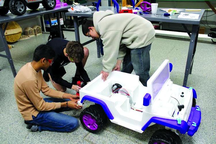 ‘Go Baby Go’ event at PHS gives ride-on cars to special children